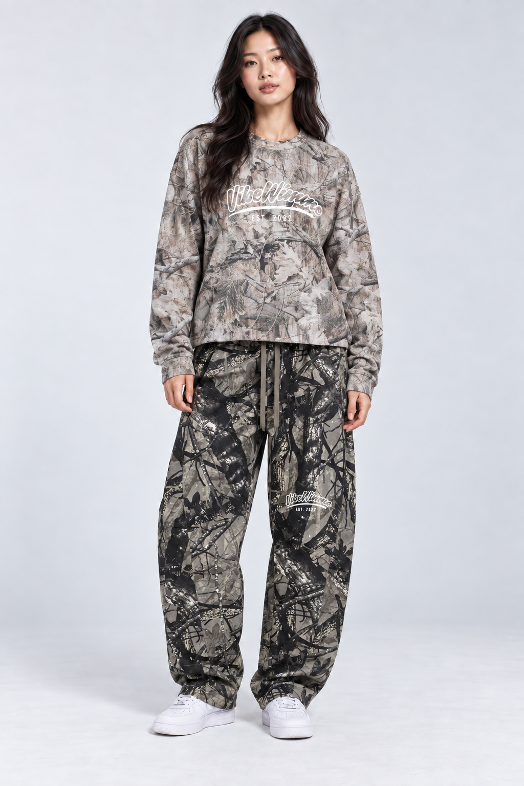 Model wearing Unisex Vibe Wimme Tree Camo Waffle T-Shirt