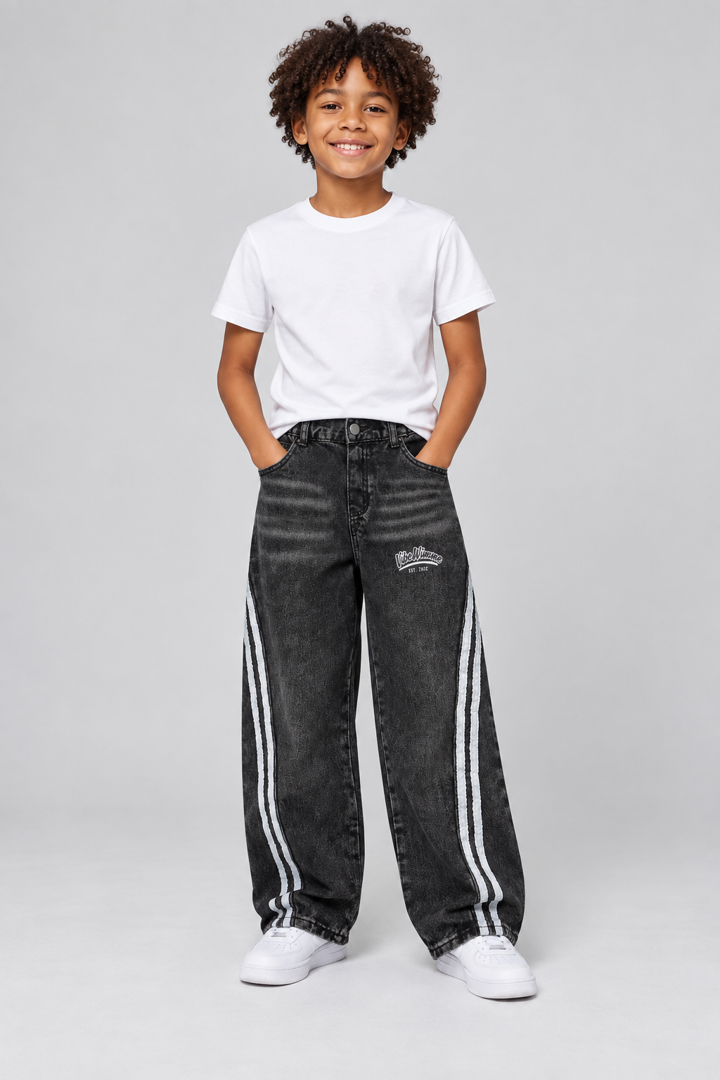 Model wearing Kid’s Vintage Wash Side Stripe Jeans