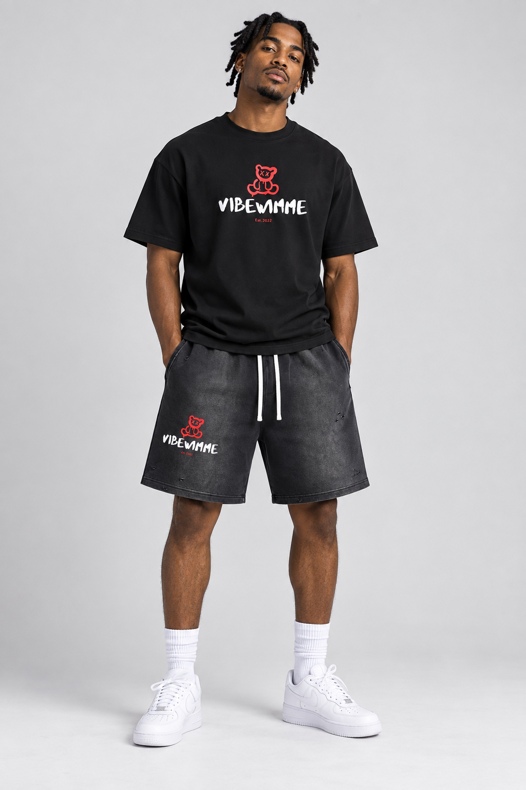 AI model in matching red teddy Vibe Wimme tee and washed shorts